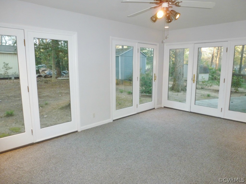 10424 Melissa Mill Road Chesterfield, VA 23236 - Photo 6 of 23 an empty room with windows and outdoor view