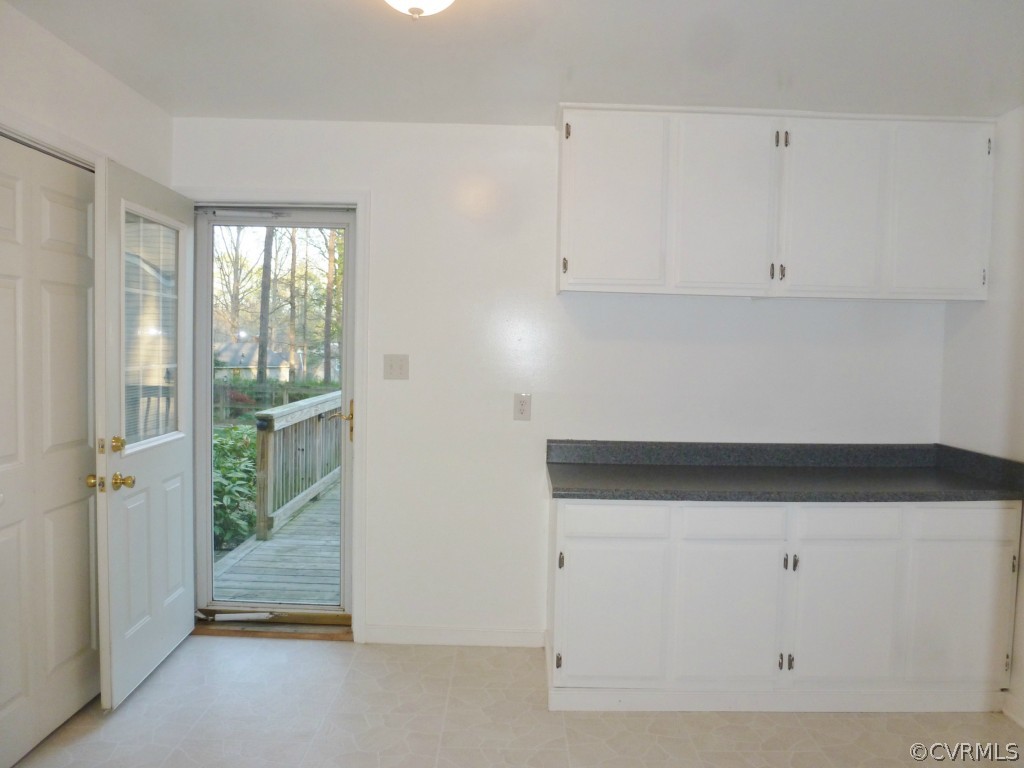 10424 Melissa Mill Road Chesterfield, VA 23236 - Photo 7 of 23 a kitchen with white cabinets and window