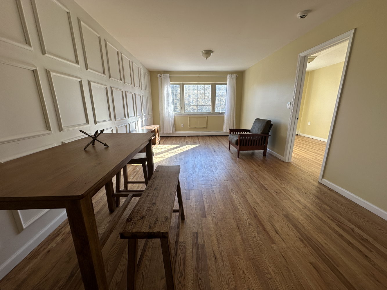 a view of a livingroom with furniture and hardwood floor
