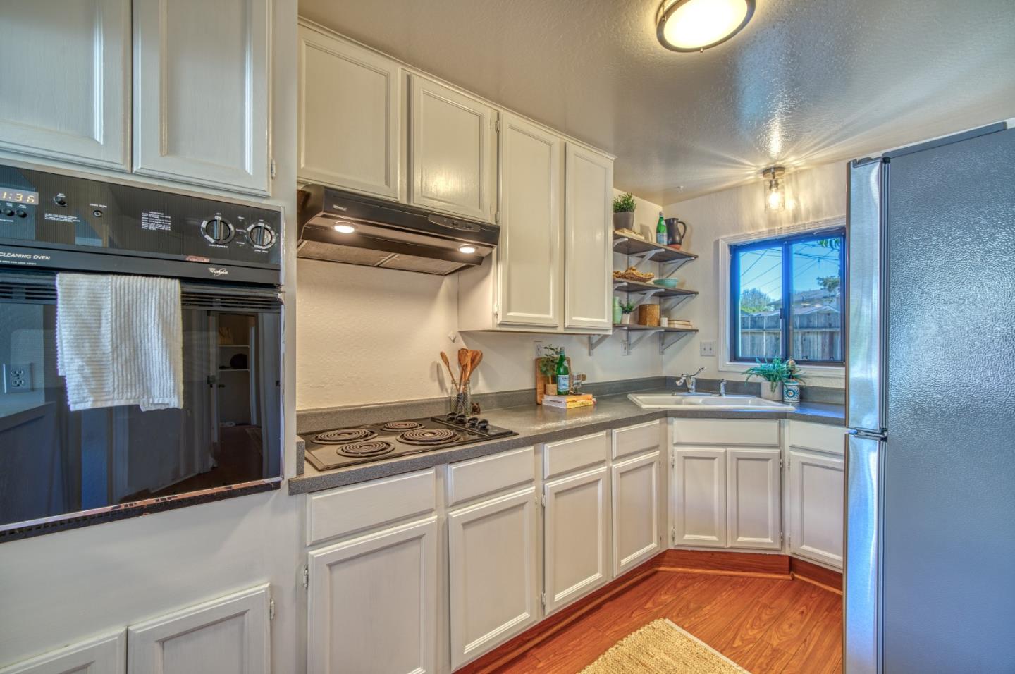421 Park Drive Aptos, CA 95003 - Photo 14 of 34 a kitchen with stainless steel appliances granite countertop a sink stove and cabinets