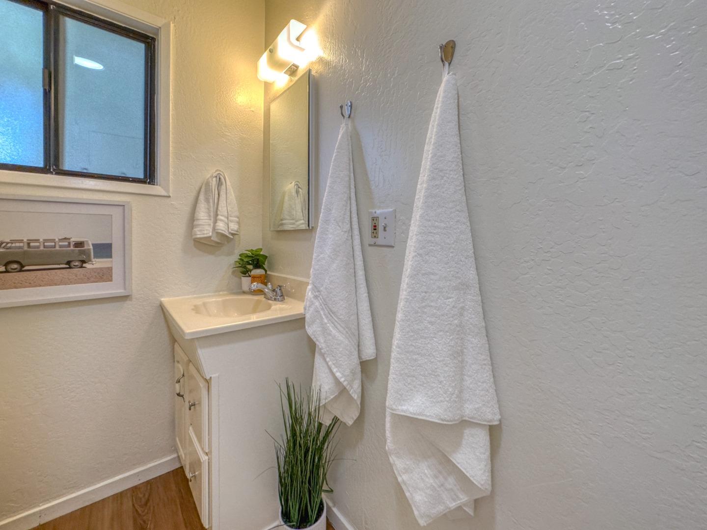 421 Park Drive Aptos, CA 95003 - Photo 25 of 34 a bathroom with a sink a vanity and a mirror
