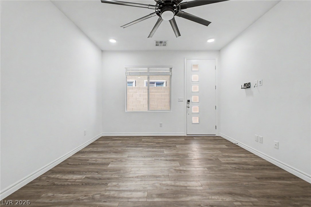 226 Augusta Ridge Henderson, NV 89015 - Photo 22 of 47 Bright, airy room with elegant wood flooring and a modern ceiling fan.