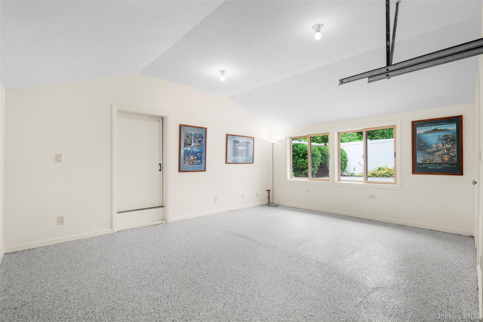 14 Ridgeland Terrace Rye, NY 10580 - Photo 26 of 37 Detached garage with epoxy flooring, EV charging, storage, and a rare garden-view office area