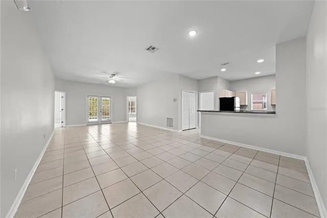 a view of a kitchen with a sink and cabinets