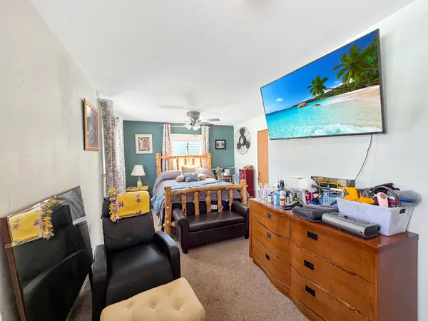 a bedroom with furniture and a window