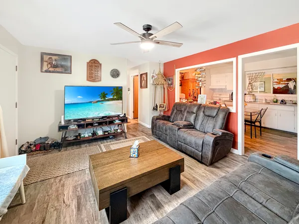 a living room with furniture and a flat screen tv