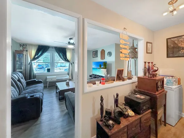 a living room with furniture and a large window