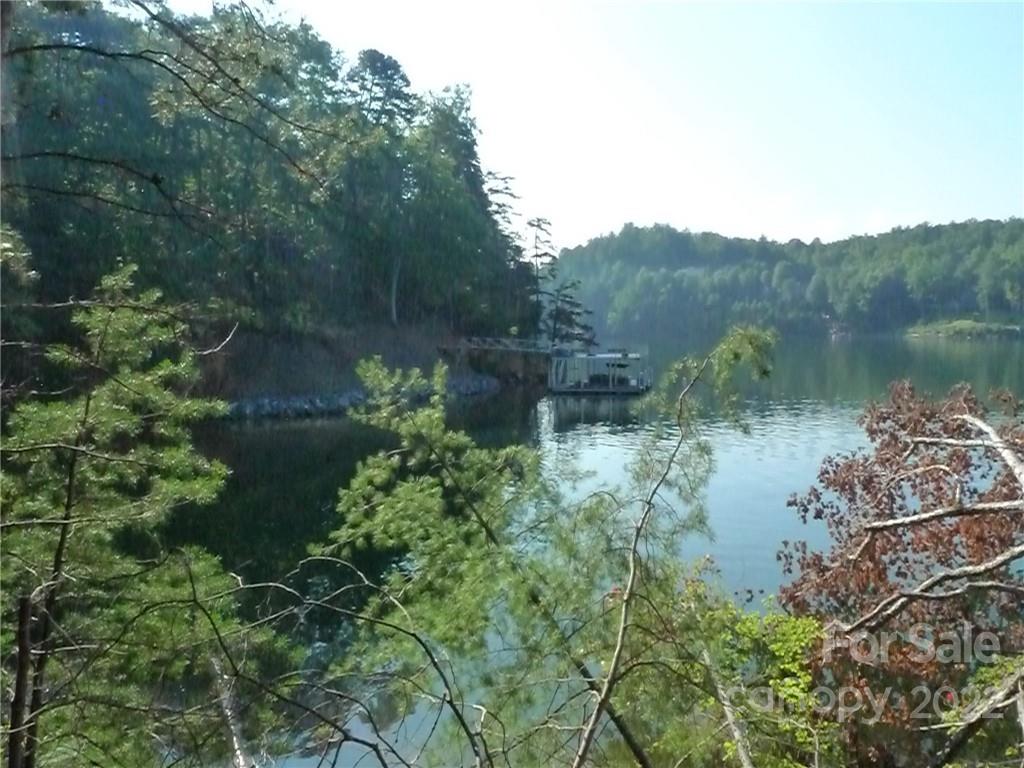 27 West Point Drive, Unit 121 Nebo, NC 28761 - Photo 11 of 21 a view of a lake in middle of forest