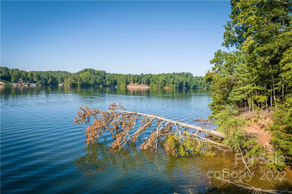 27 West Point Drive, Unit 121 Nebo, NC 28761 - Photo 20 of 21 a view of a lake with a mountain in the background