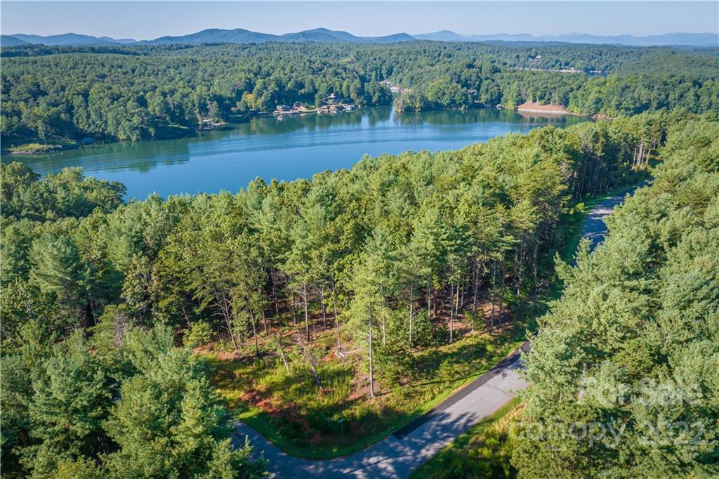 27 West Point Drive, Unit 121 Nebo, NC 28761 - Photo 3 of 21 a view of a lake with mountains in the background