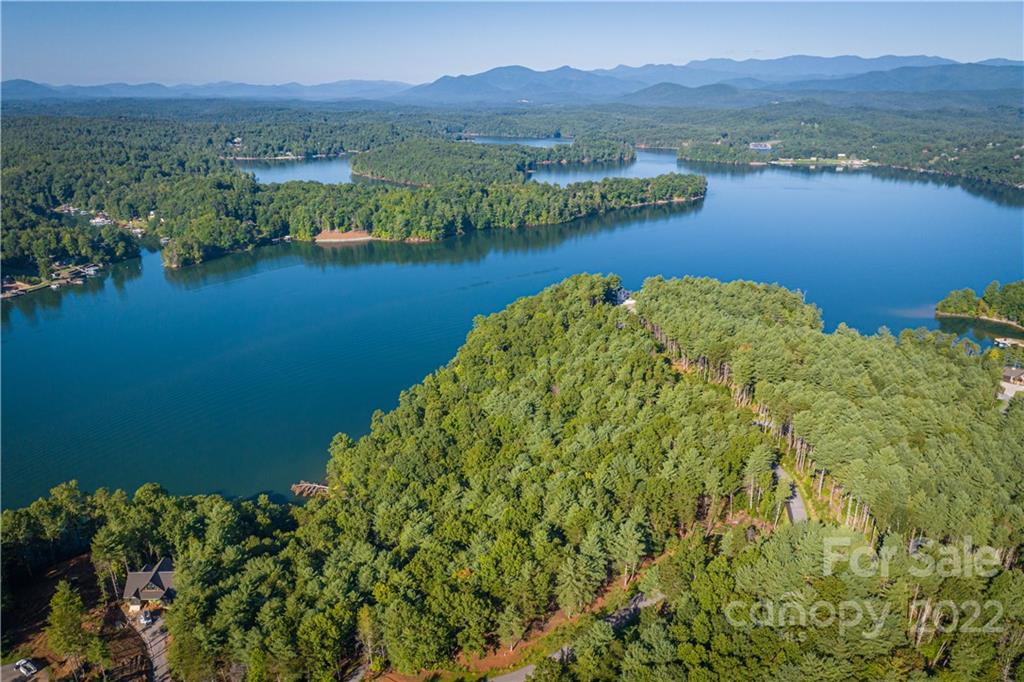 27 West Point Drive, Unit 121 Nebo, NC 28761 - Photo 4 of 21 a view of a lake with a city