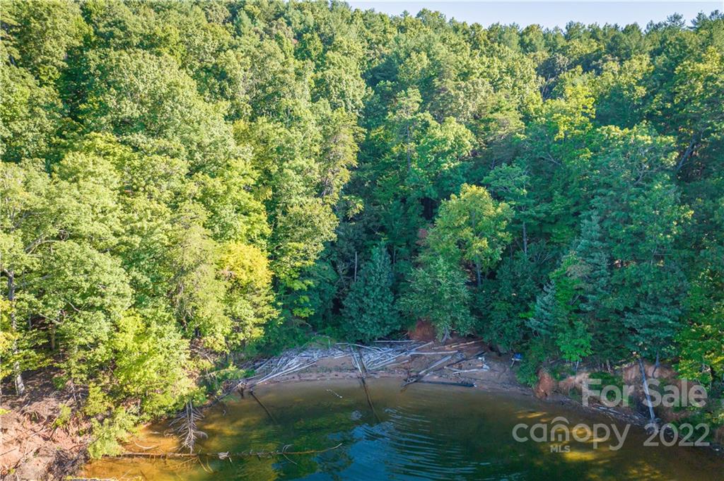 27 West Point Drive, Unit 121 Nebo, NC 28761 - Photo 8 of 21 a view of a lake with a yard