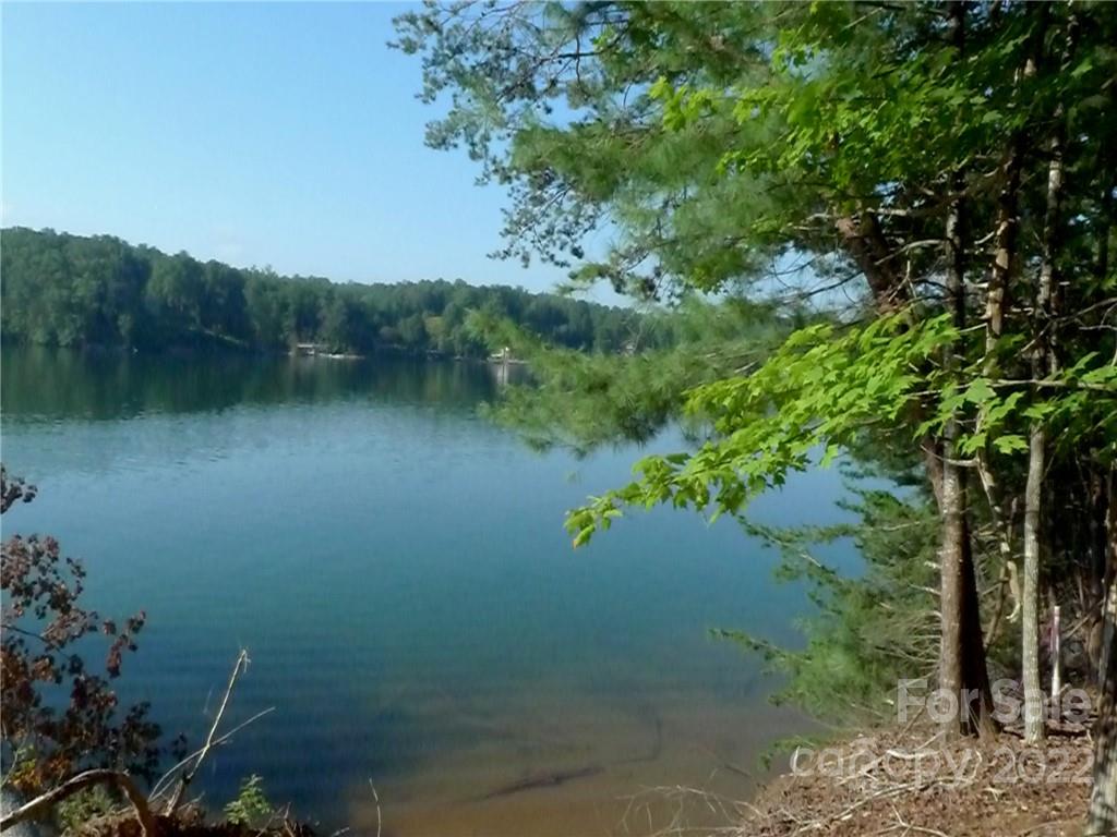 27 West Point Drive, Unit 121 Nebo, NC 28761 - Photo 10 of 21 a view of a lake with lots of trees