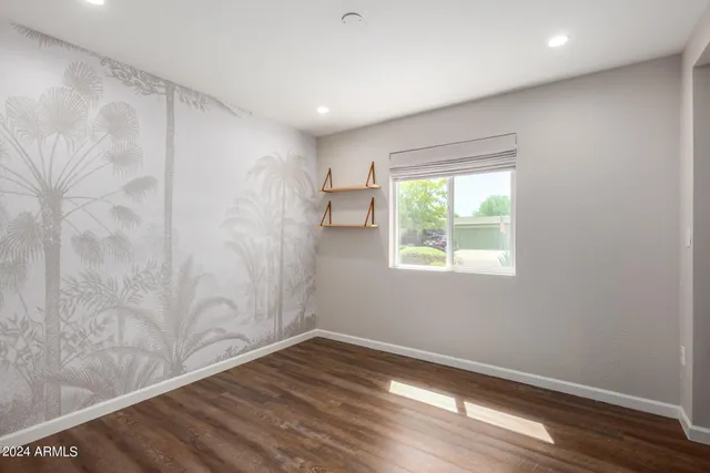 a bathroom with a sink toilet a mirror and shower