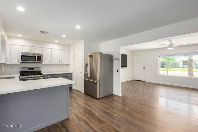 a view of a kitchen cabinets and wooden floor