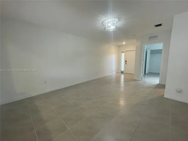 an empty room with a bathroom