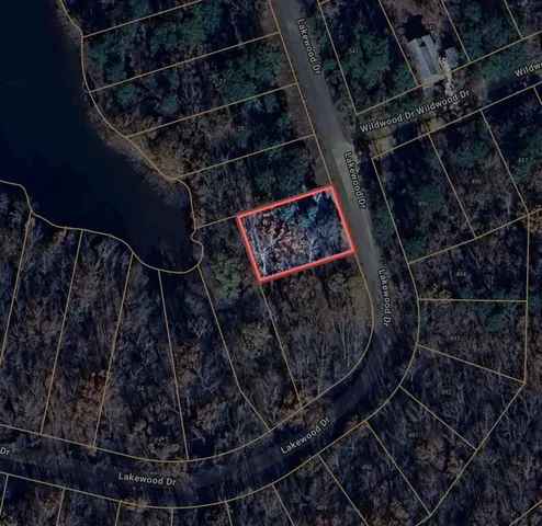 a view of a wooden fence and a bench