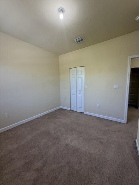 23765 Southwest 118 Avenue, Unit 23765 Homestead, FL 33032 - Photo 20 of 36 a view of an empty room and window