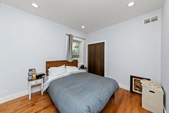 a bedroom with a bed and a tv