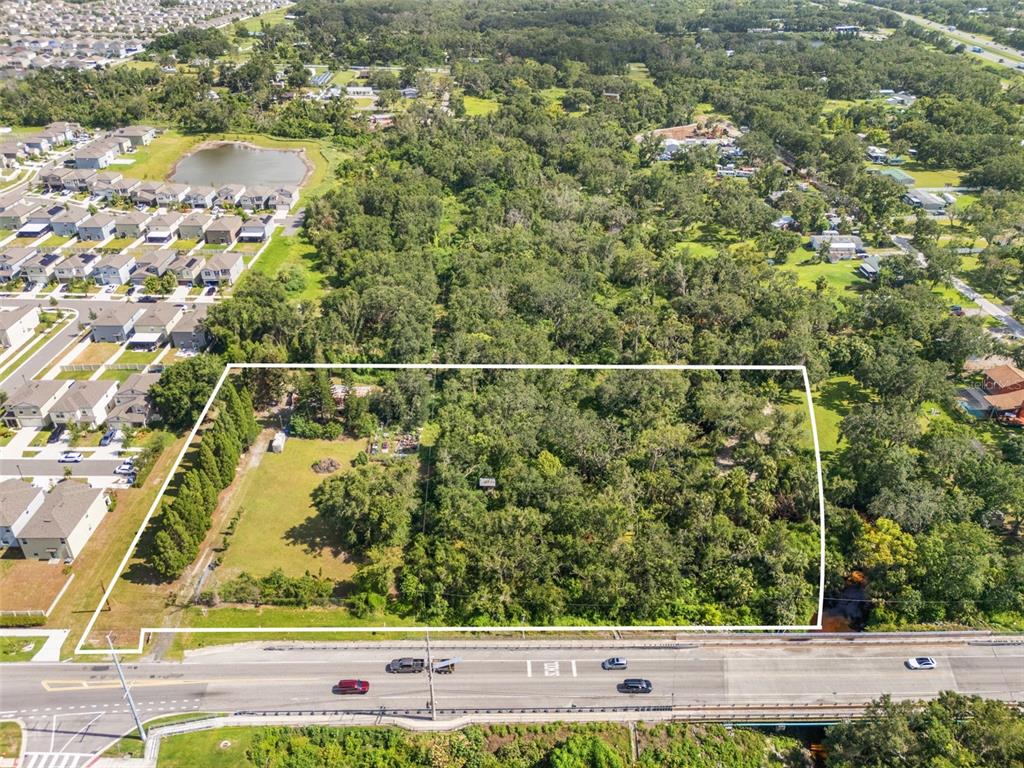 9889 Symmes Road Riverview, FL 33578 - Photo 3 of 11 a view of a yard