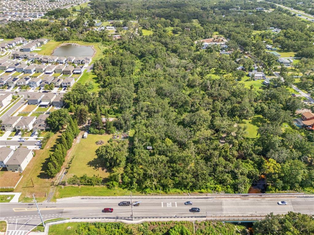 9889 Symmes Road Riverview, FL 33578 - Photo 4 of 11 a view of a yard with an outdoor space