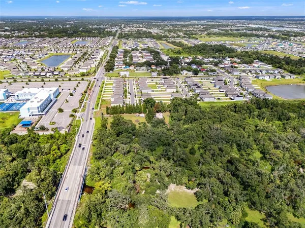 an aerial view of residential building and lake view