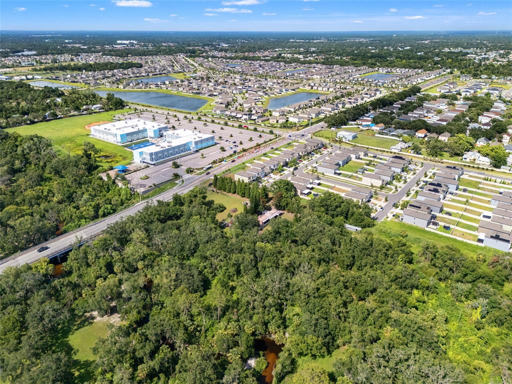 9889 Symmes Road Riverview, FL 33578 - Photo 6 of 11 an aerial view of residential houses with outdoor space and river