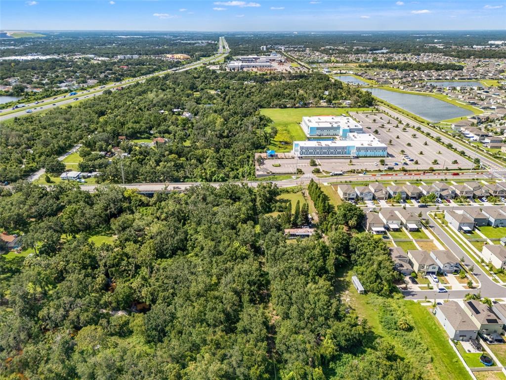 9889 Symmes Road Riverview, FL 33578 - Photo 7 of 11 an aerial view of residential building and lake view