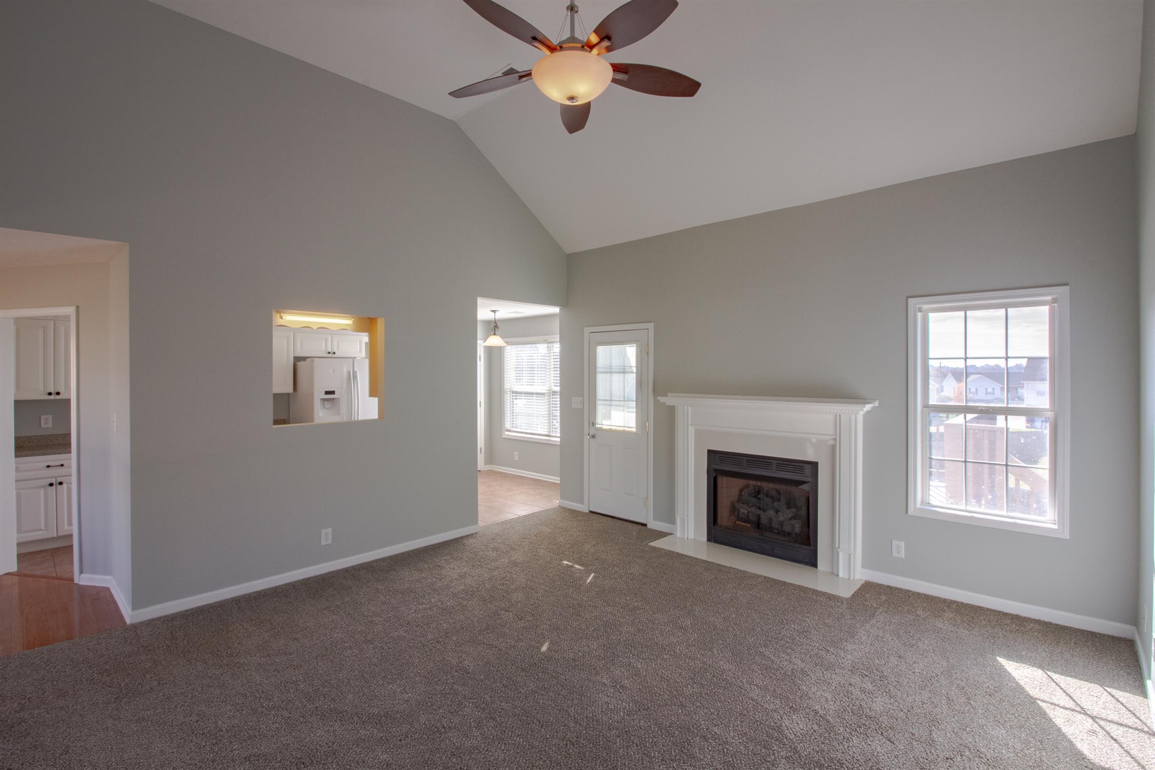 Great Room with Soaring Ceilings, New Carpet & Fireplace