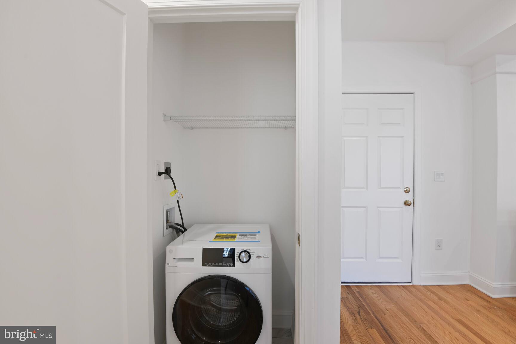 1351 Wisconsin Avenue Northwest, Unit 2B Washington, DC 20007 - Photo 15 of 20 a view of storage and utility room with washer and dryer
