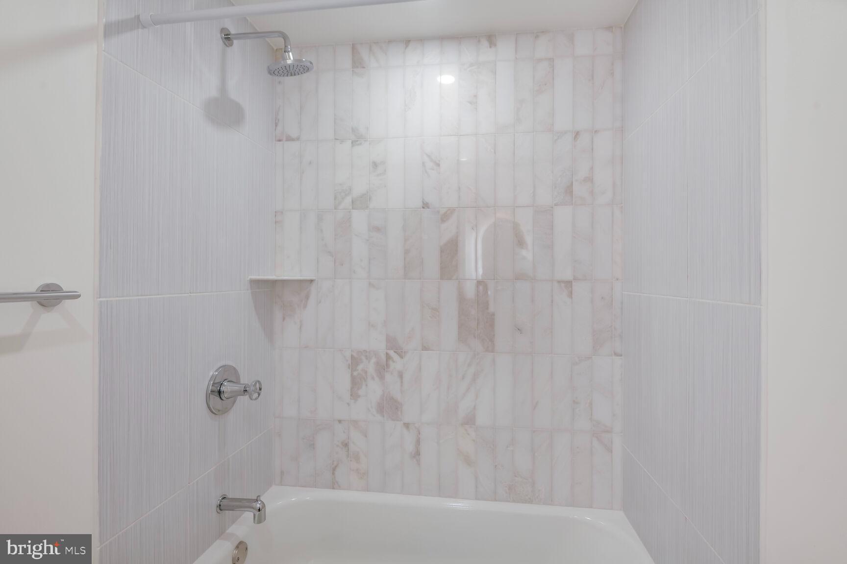 1351 Wisconsin Avenue Northwest, Unit 2B Washington, DC 20007 - Photo 20 of 20 a bathroom with a bathtub