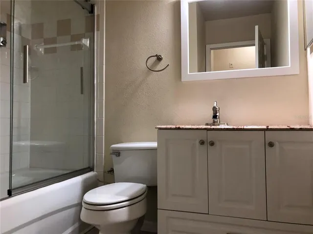 a bathroom with a toilet and a sink