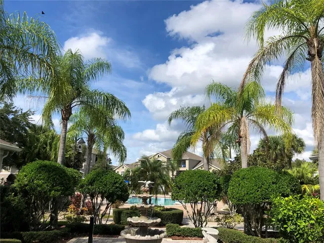 a view of a water fountain with a fountain in the patio
