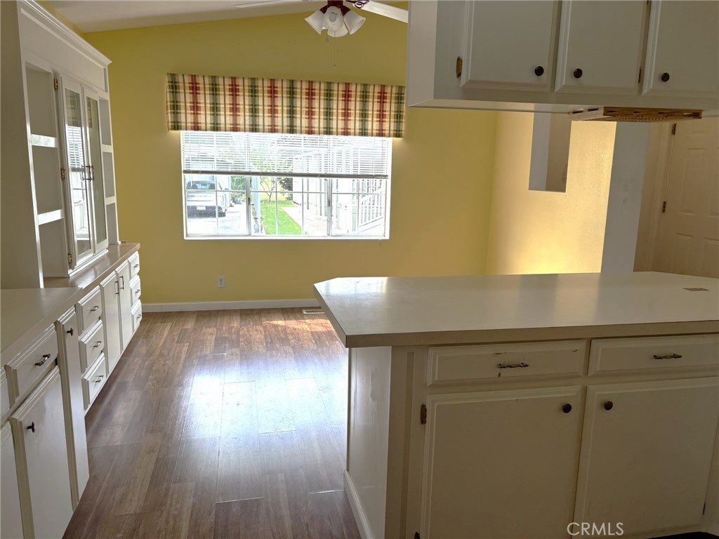 5813 Pacific Heights Road, Unit 126 Oroville, CA 95965 - Photo 12 of 59 a view of kitchen with window and wooden floor