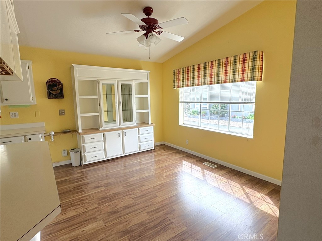 5813 Pacific Heights Road, Unit 126 Oroville, CA 95965 - Photo 14 of 59 a view of an empty room with a window and wooden floor