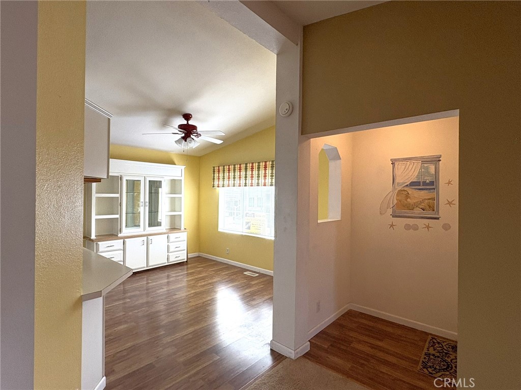 5813 Pacific Heights Road, Unit 126 Oroville, CA 95965 - Photo 15 of 59 a view of an empty room with wooden floor and a window