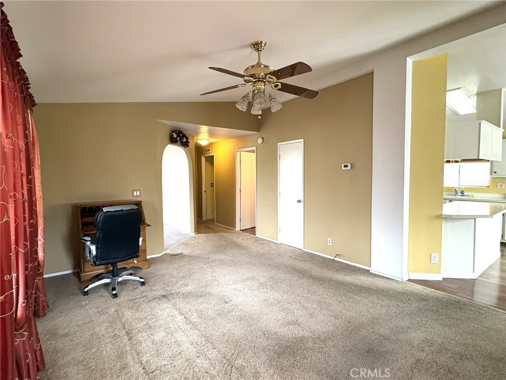 5813 Pacific Heights Road, Unit 126 Oroville, CA 95965 - Photo 17 of 59 a view of a livingroom with a table and a chandelier