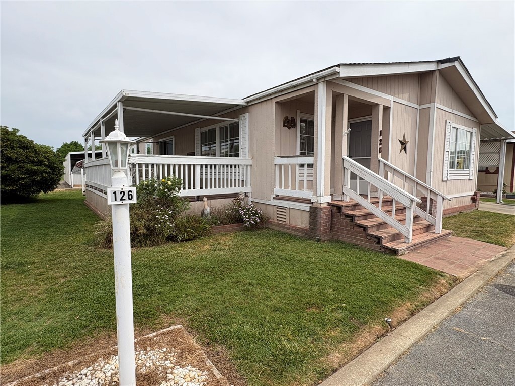 5813 Pacific Heights Road, Unit 126 Oroville, CA 95965 - Photo 2 of 59 a front view of a house with garden