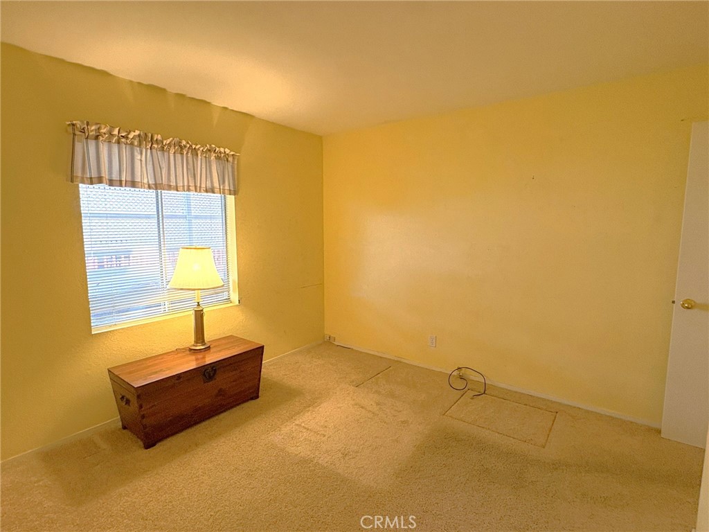 5813 Pacific Heights Road, Unit 126 Oroville, CA 95965 - Photo 30 of 59 a room with a couch and wooden floor