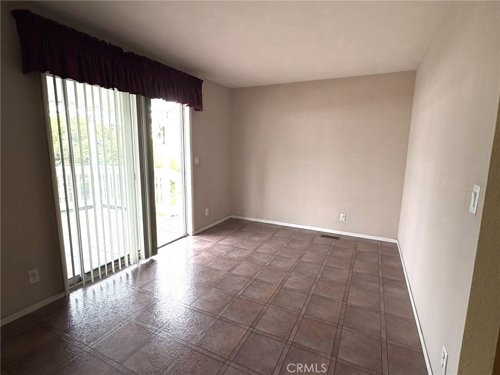 5813 Pacific Heights Road, Unit 126 Oroville, CA 95965 - Photo 39 of 59 an empty room with wooden floor and windows
