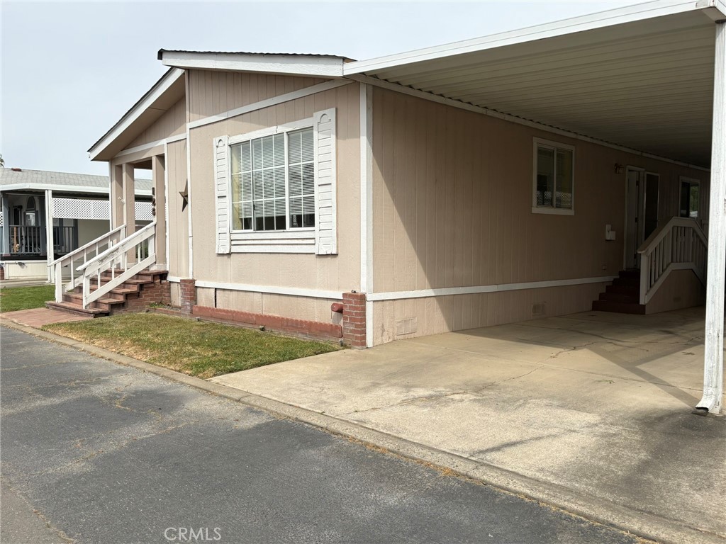 5813 Pacific Heights Road, Unit 126 Oroville, CA 95965 - Photo 50 of 59 a view of a house with car parked in front of it