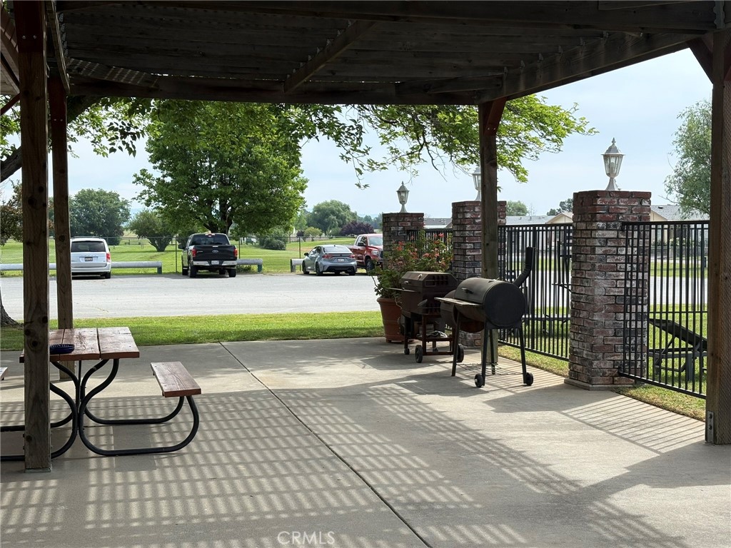 5813 Pacific Heights Road, Unit 126 Oroville, CA 95965 - Photo 56 of 59 a view of a porch with furniture and garden