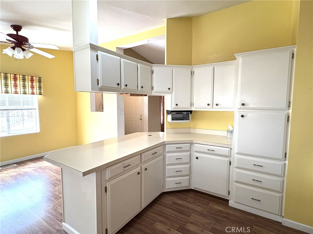 5813 Pacific Heights Road, Unit 126 Oroville, CA 95965 - Photo 10 of 59 a kitchen with a sink a stove and cabinets