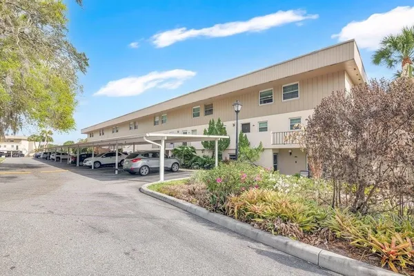 a view of a parking area with garage