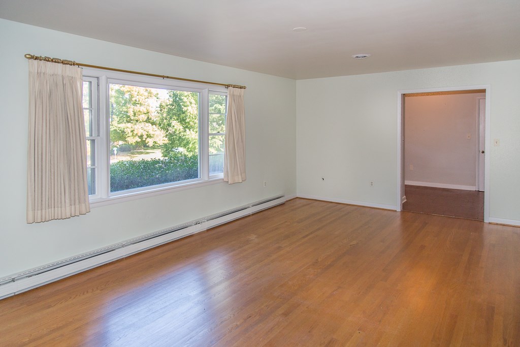 1700 Brunswick Road Waynesboro, VA 22980 - Photo 11 of 44 a view of empty room with wooden floor and fan