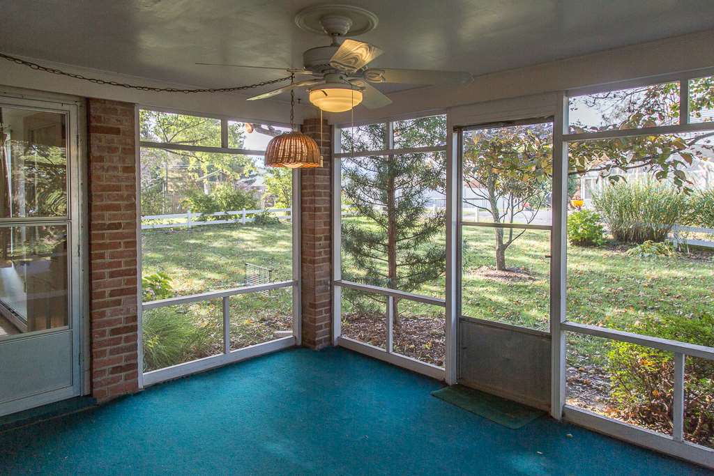 1700 Brunswick Road Waynesboro, VA 22980 - Photo 19 of 44 a view of an empty room with wooden floor and a floor to ceiling window