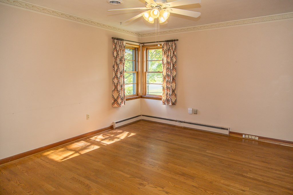 1700 Brunswick Road Waynesboro, VA 22980 - Photo 27 of 44 an empty room with wooden floor and windows