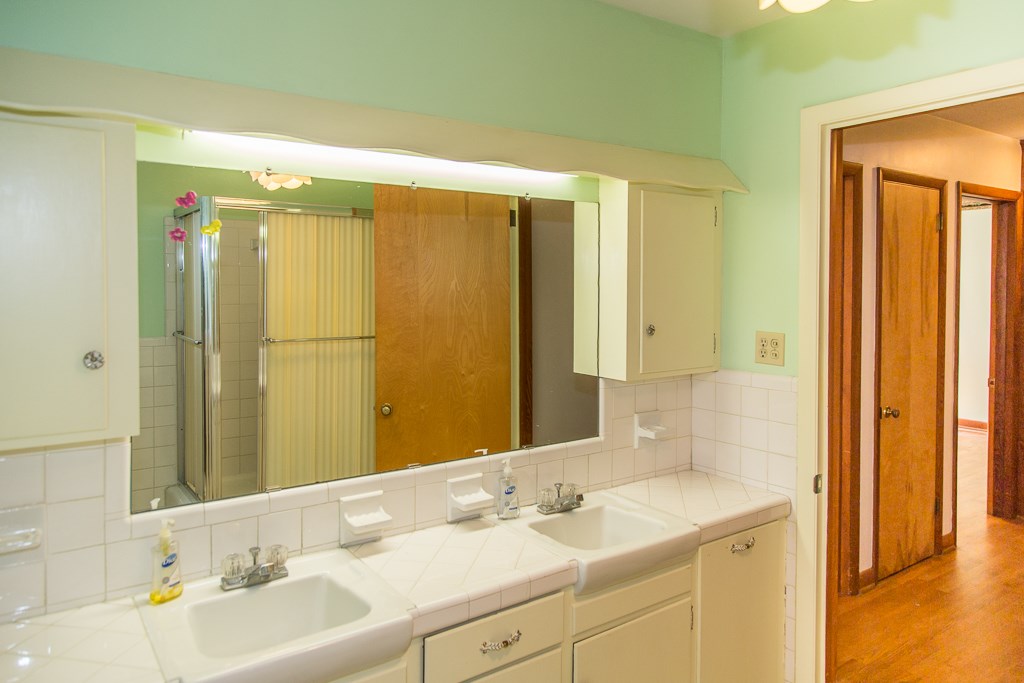 1700 Brunswick Road Waynesboro, VA 22980 - Photo 28 of 44 a bathroom with a sink and a mirror