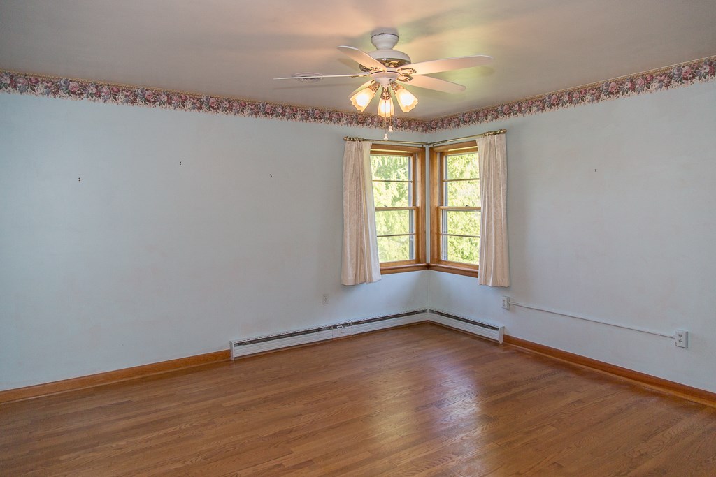 1700 Brunswick Road Waynesboro, VA 22980 - Photo 29 of 44 wooden floor in an empty room with a window