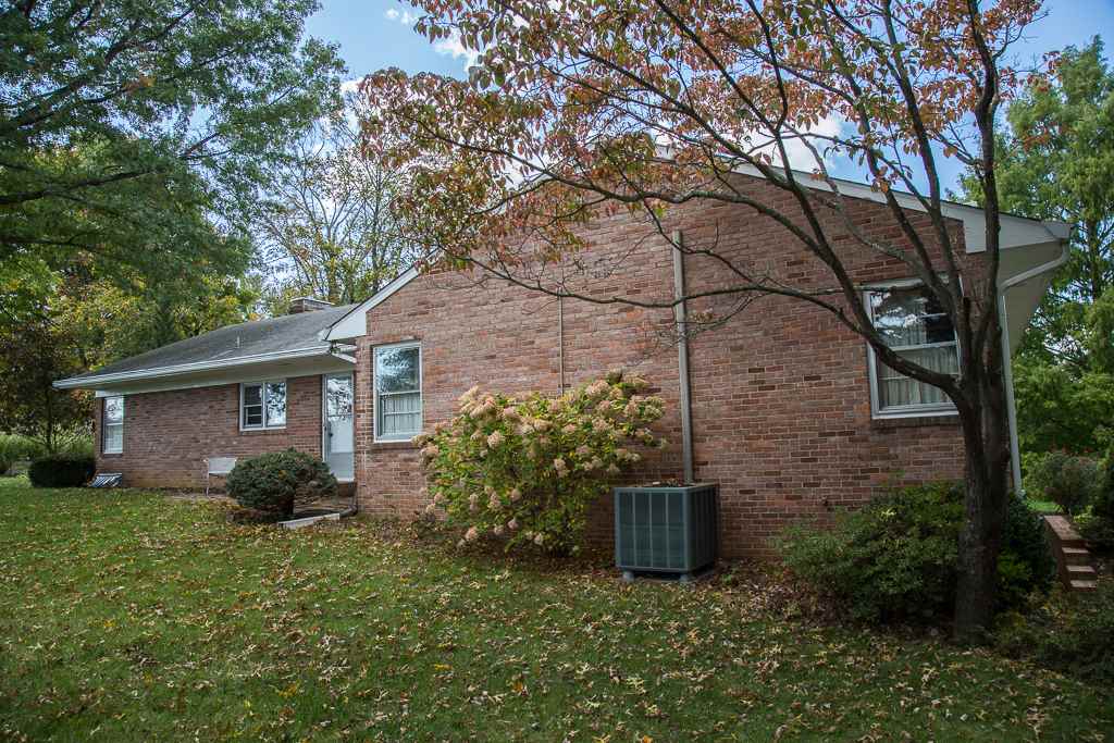 1700 Brunswick Road Waynesboro, VA 22980 - Photo 5 of 44 a view of a wooden house with a yard and large trees